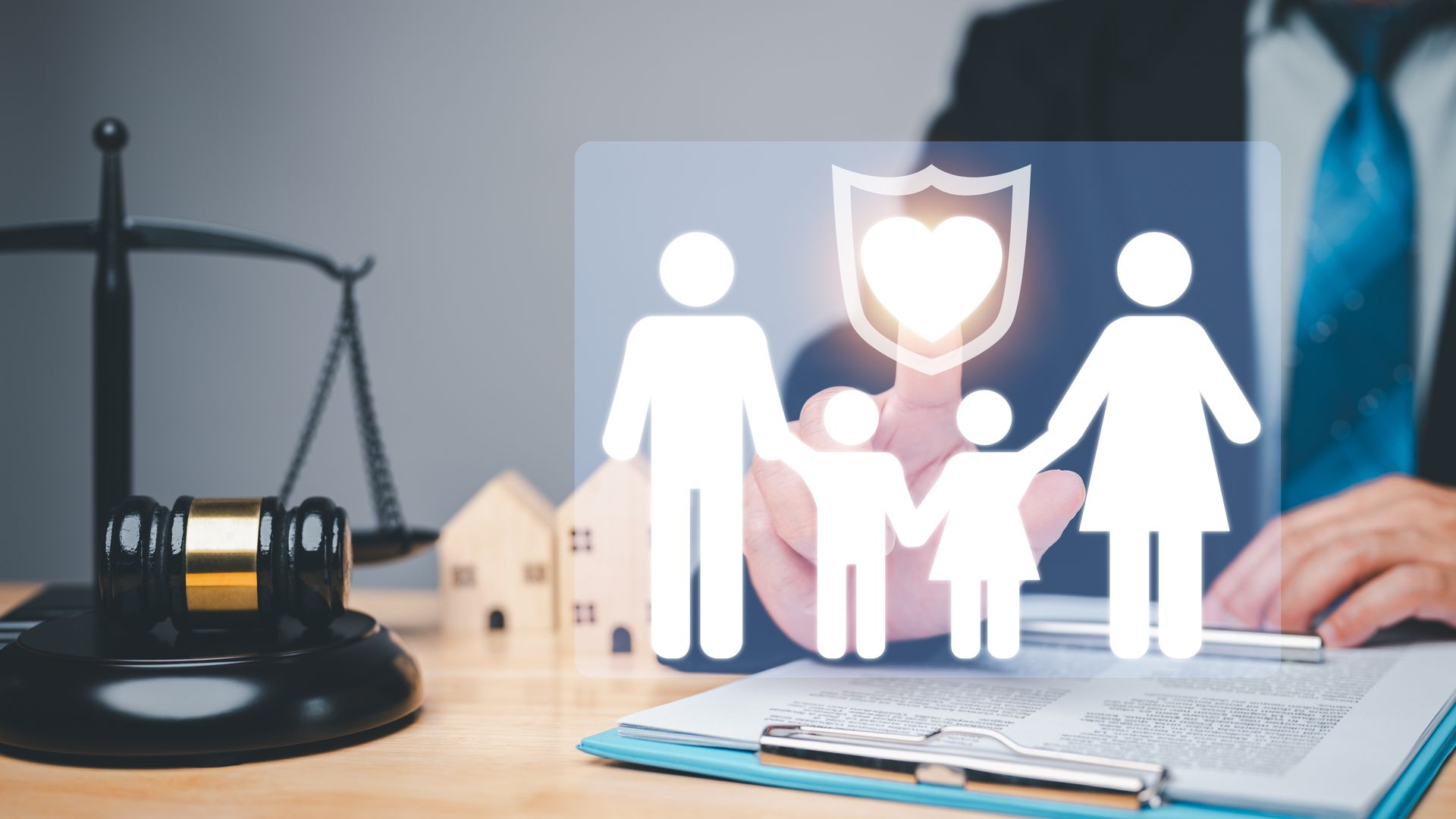 A woman is signing a document in front of a lawyer and a man with a child. Child visitation rights attorney reviewing a parenting time schedule with a parent.