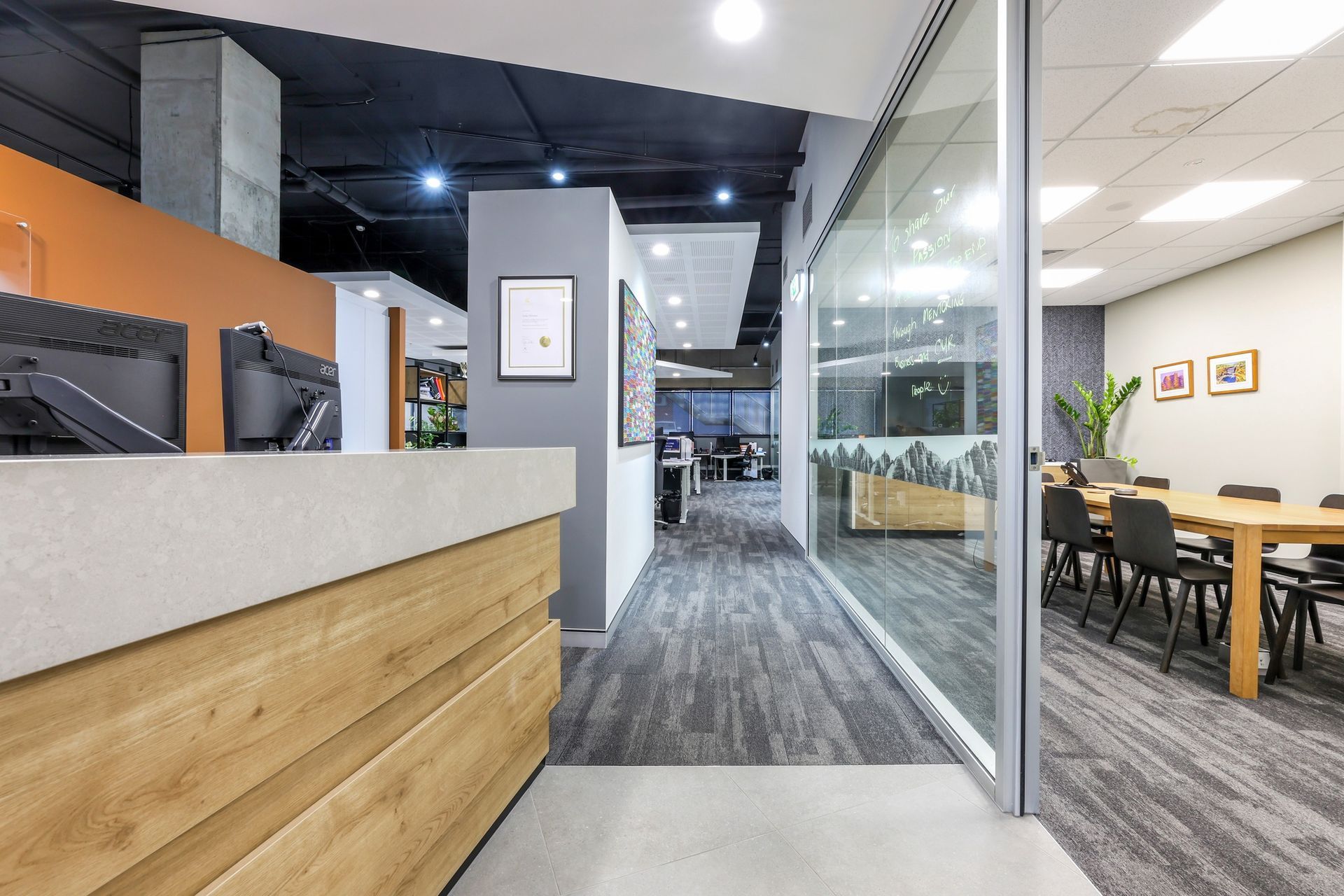 A Reception Area with A Wooden Counter — Invision NT in Coconut Grove, NT