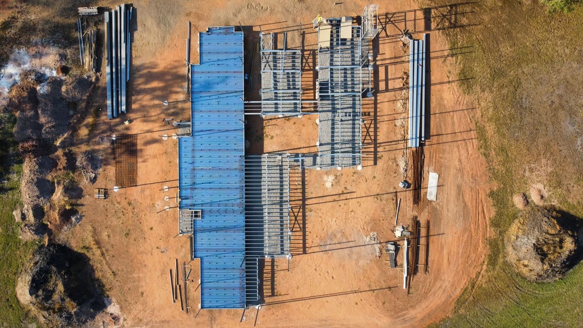 A View of Construction Site with Foundation and Building Materials — Invision NT in Coconut Grove, NT