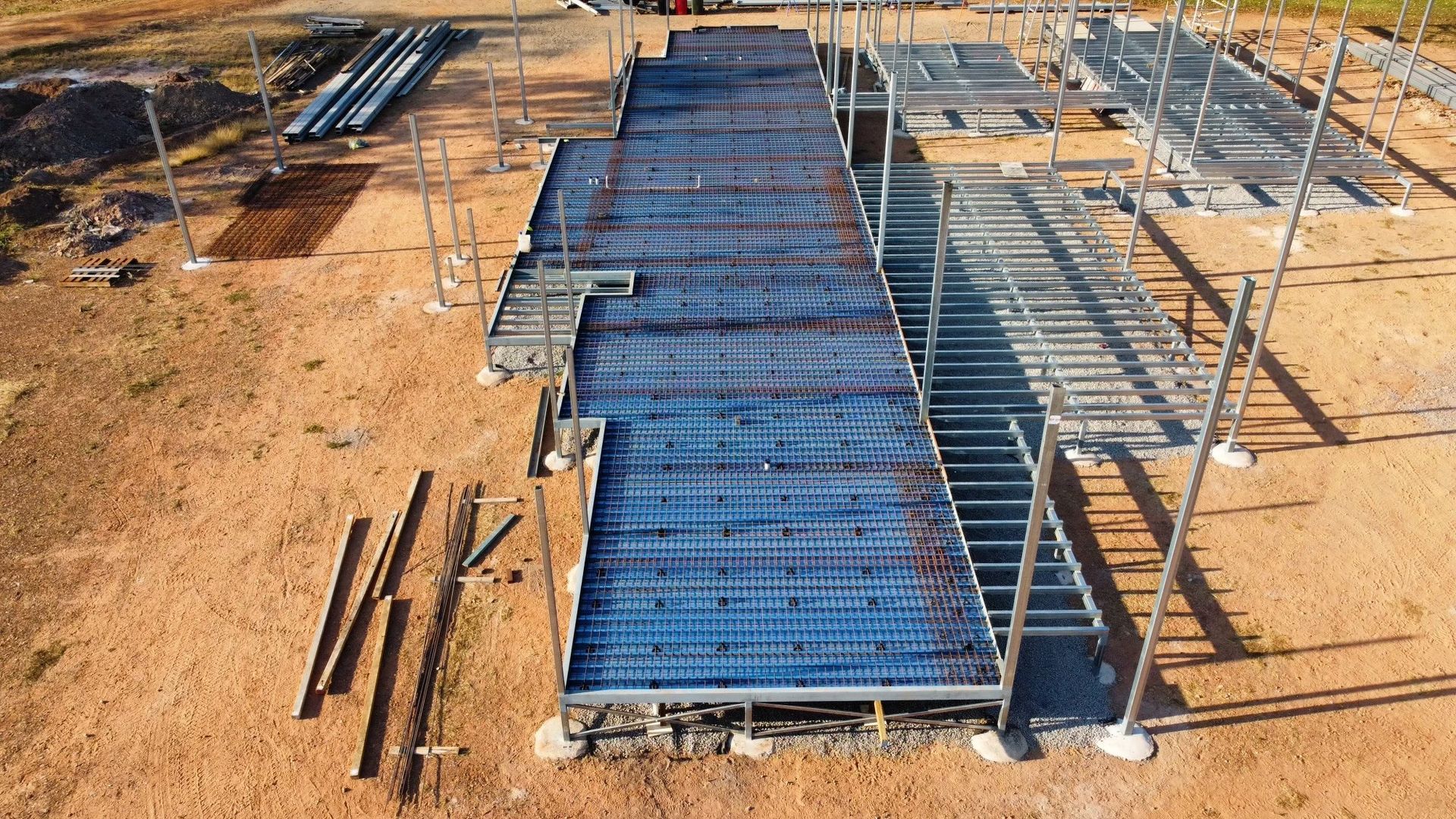 A Construction Site with Steel Framework and Rebar Grid — Invision NT in Katherine, NT