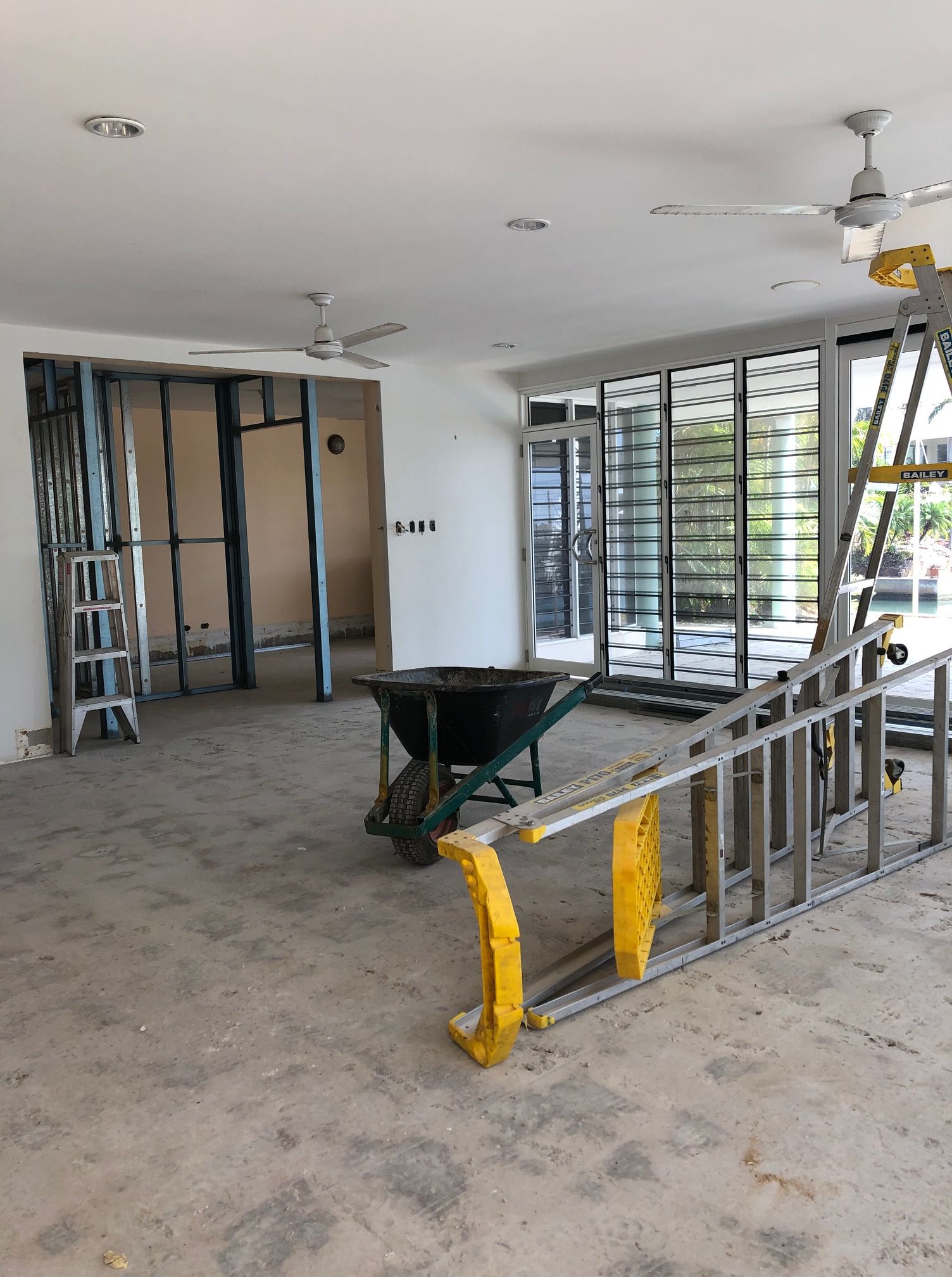 An Interior View of A Room Under Construction with Ladders — Invision NT in Coconut Grove, NT