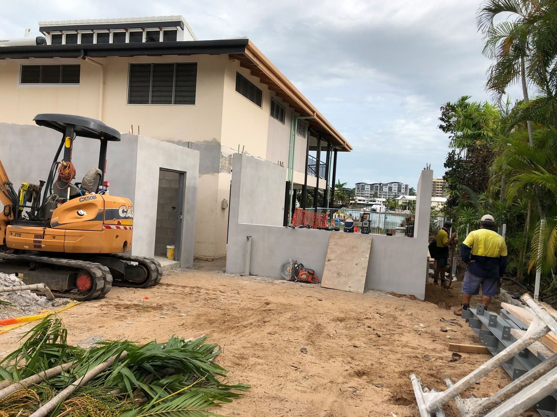 A Construction Site with An Excavator and Workers — Invision NT in Coconut Grove, NT
