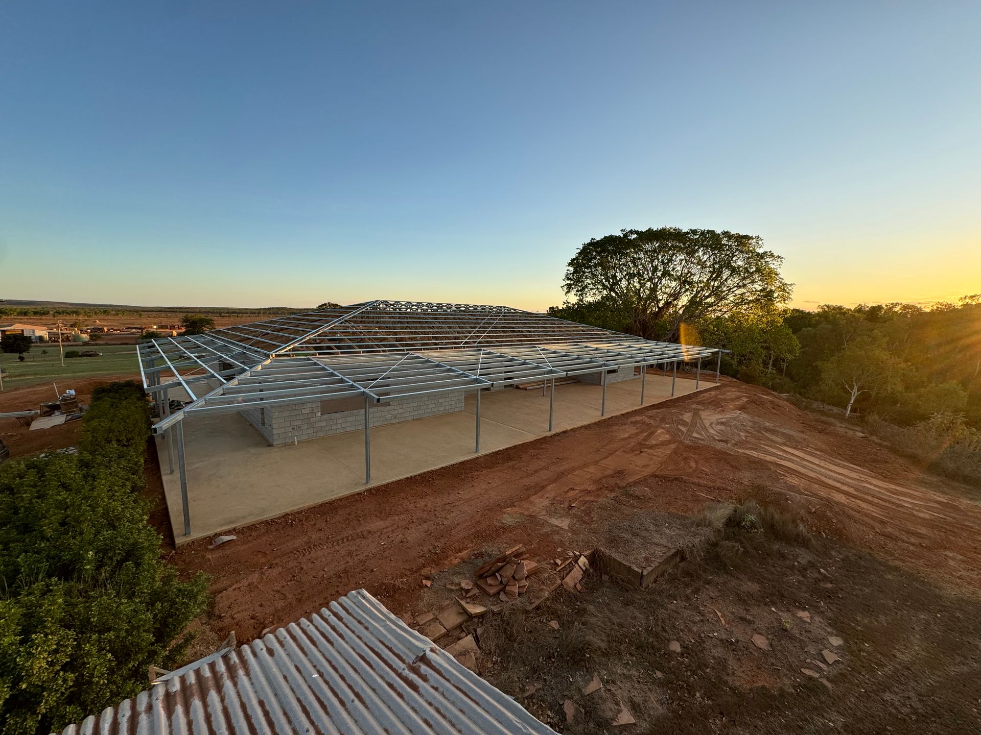 A Construction Site with A Metal Framed Building — Invision NT in Coconut Grove, NT