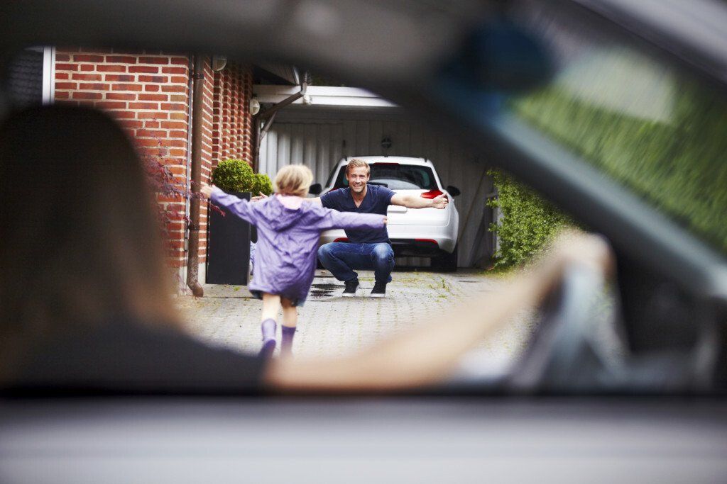 young child runs to hug adult