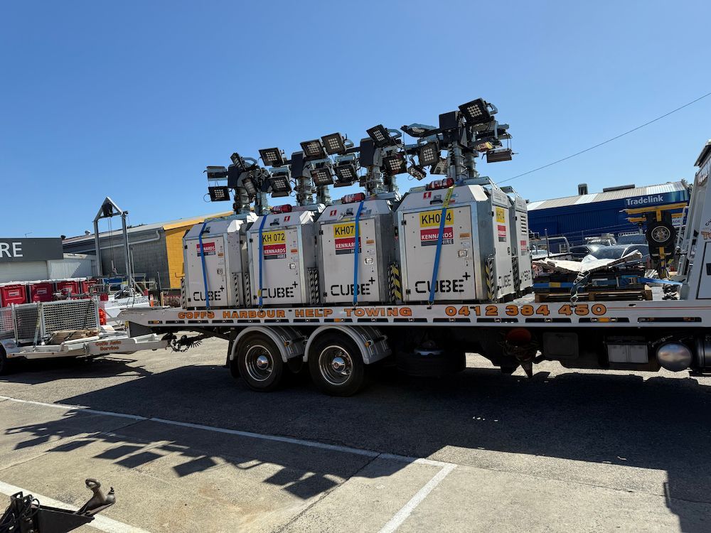 Flatbed Trailer Loaded With White Equipment Units — Coffs Harbour Help Towing in Coffs Harbour, NSW