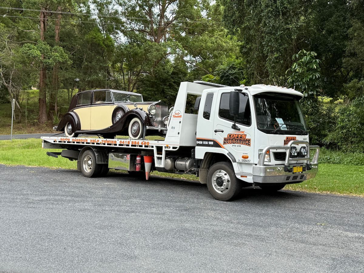 White Tow Truck Carrying a Beige Vintage Car — Coffs Harbour Help Towing in Coffs Harbour, NSW
