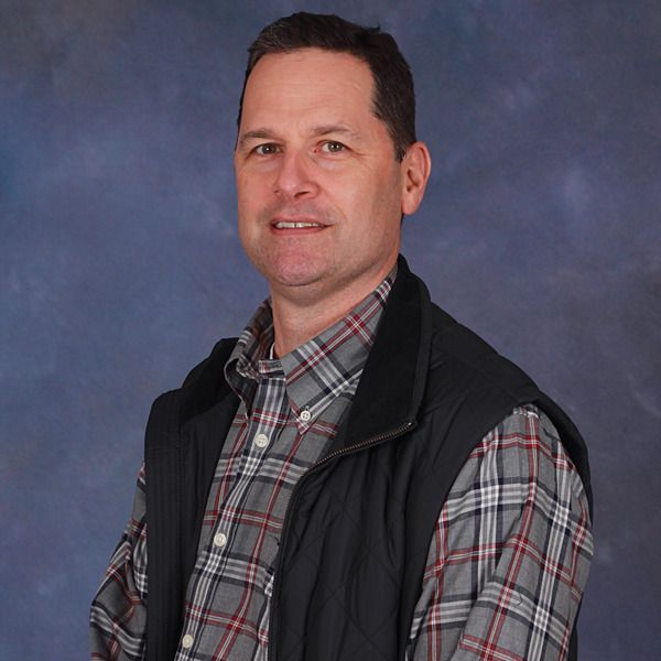 A man wearing a vest