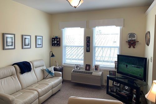 A living room with a couch and a flat screen tv