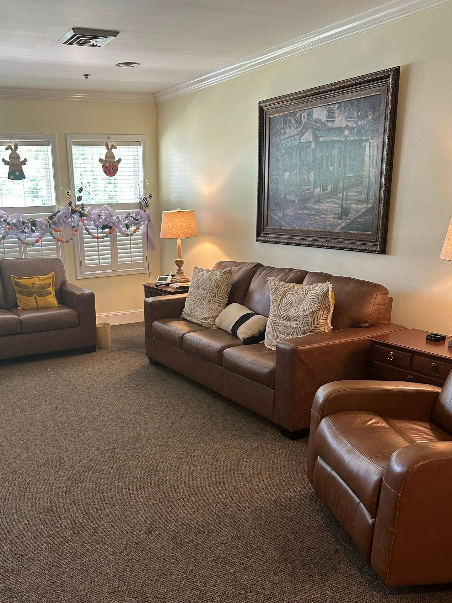 A living room with two couches and two chairs. Independent senior living community near New Bern, NC.