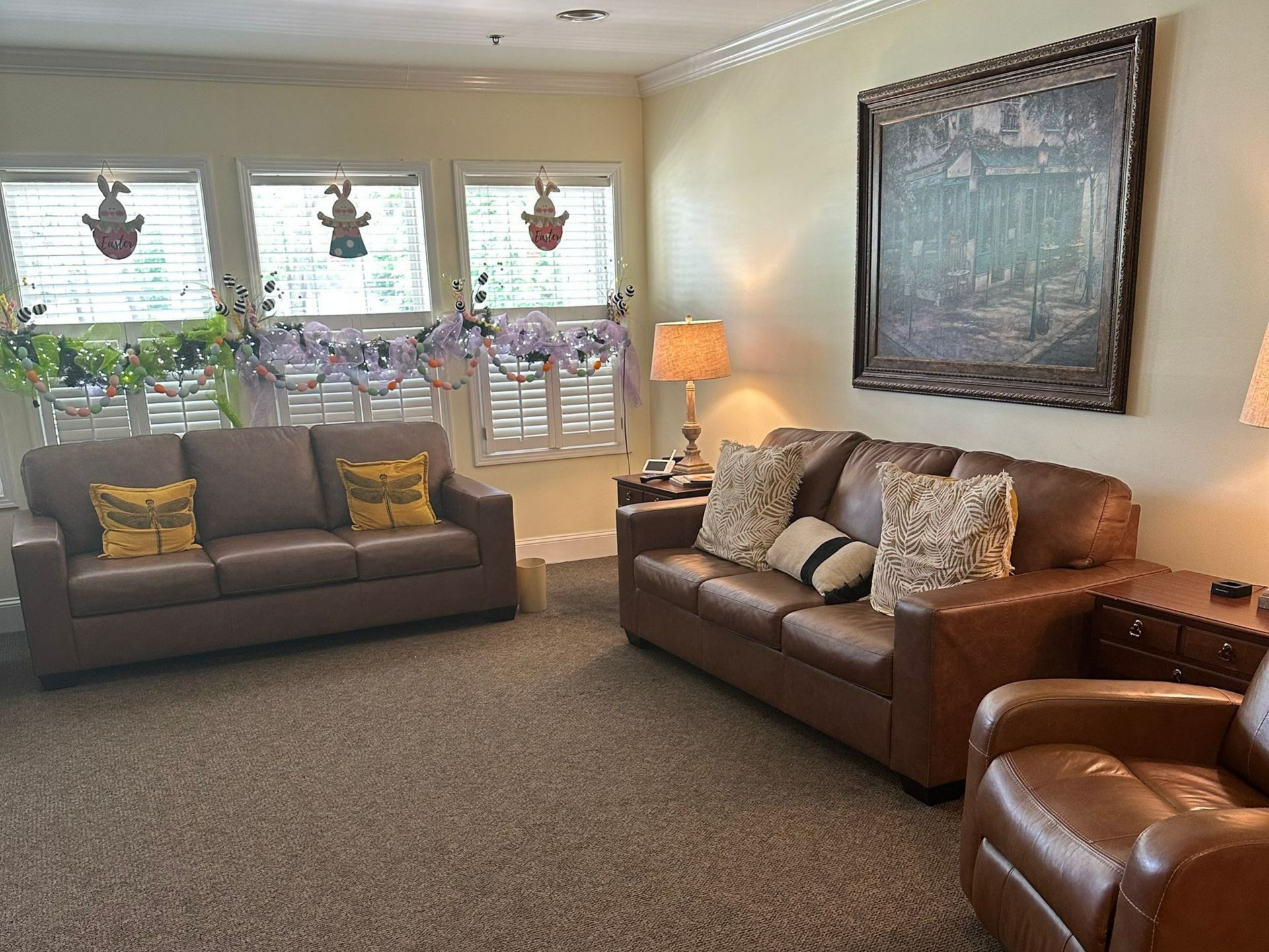 A living room with two couches and two chairs near Raleigh, NC.