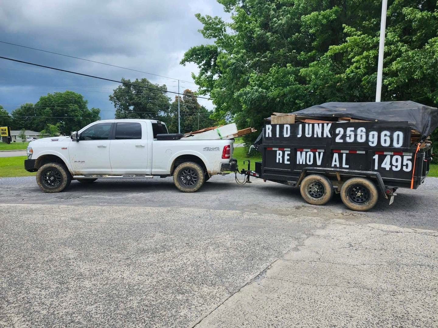a car is parked on the side of the road next to a pile of junk