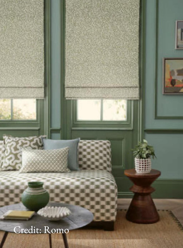 Green living room design incorporating small-scale pattern fabrics