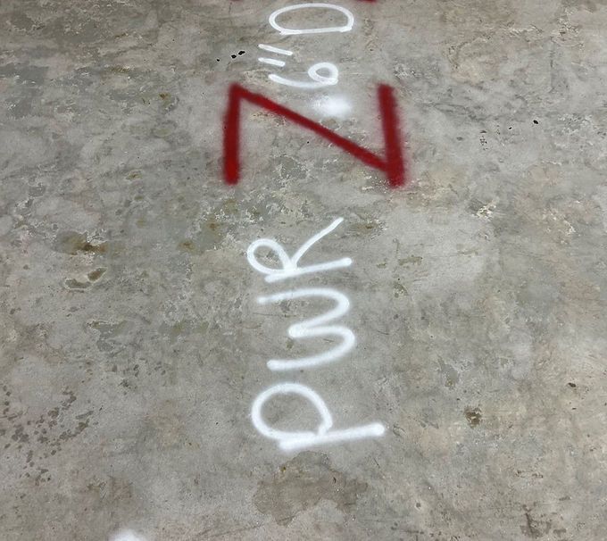 Red “Z” and white chalk letters on a concrete floor, reading “pwr z 9.0”.