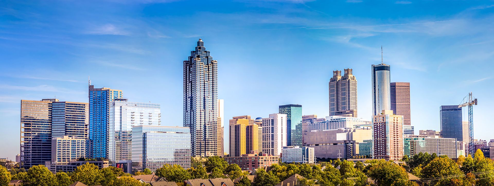 City skyline with tall modern skyscrapers under a clear blue sky
