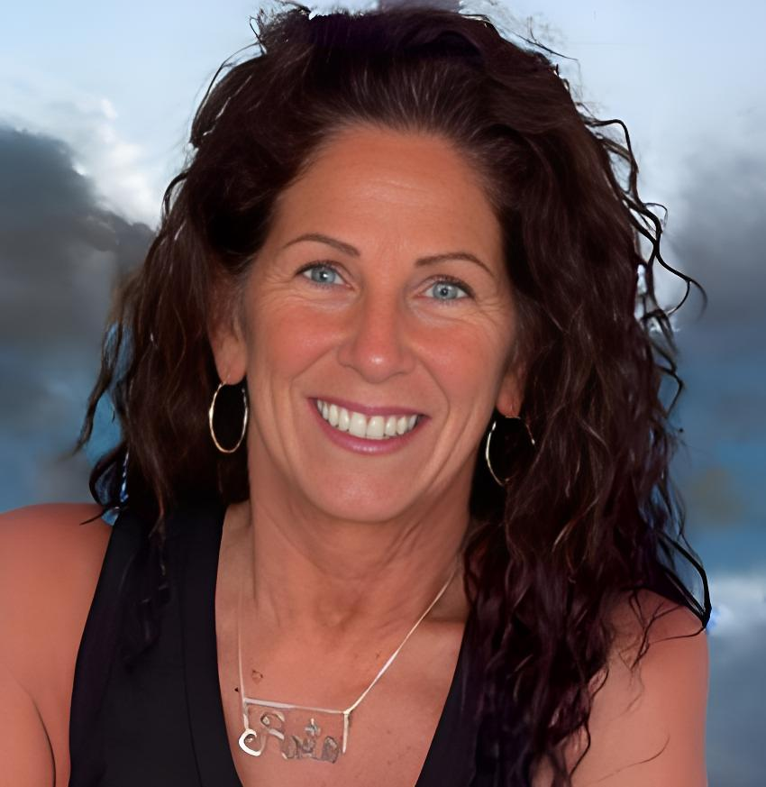 A woman wearing a black tank top and a necklace with the name chris on it