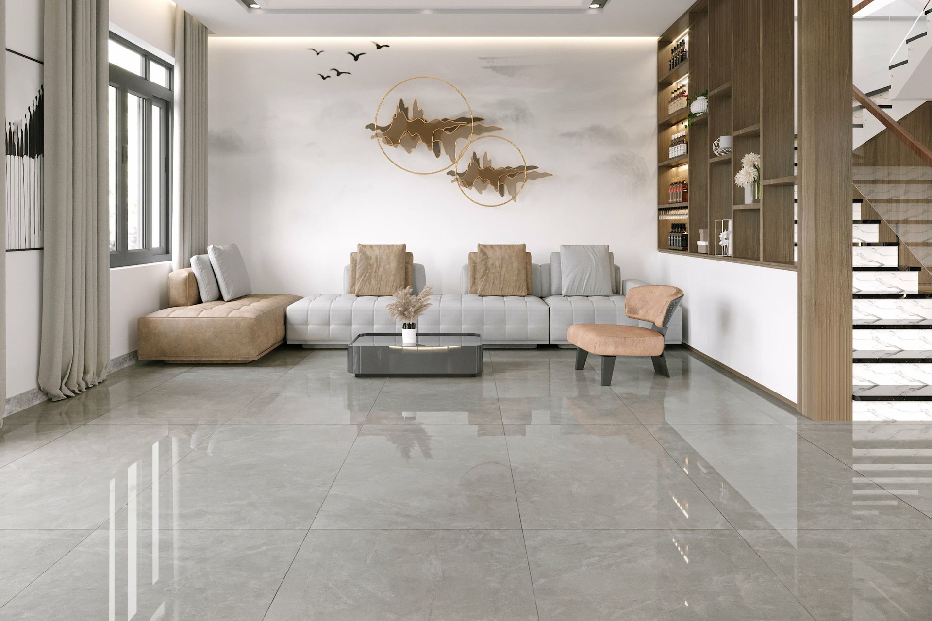 Modern living room with gray sofa, beige chairs, wood accents, and glossy tiled floor