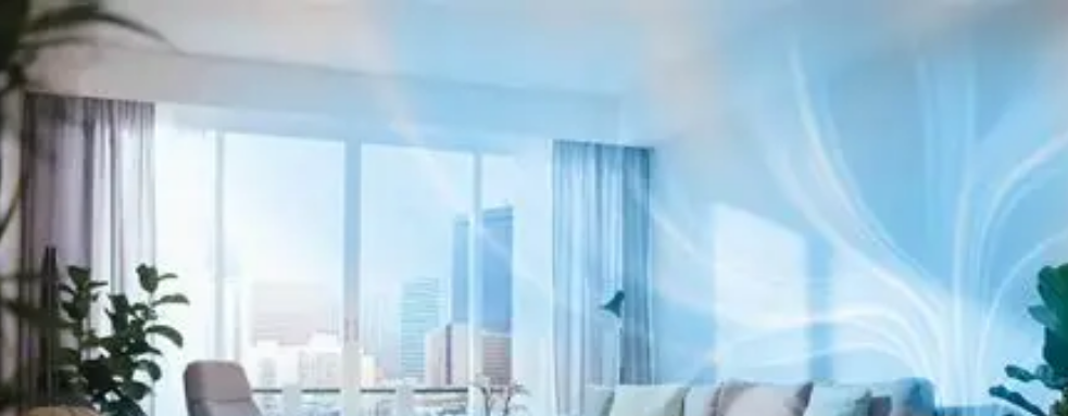 Bright modern living room with floor-to-ceiling windows, sheer curtains, and blue abstract wall art