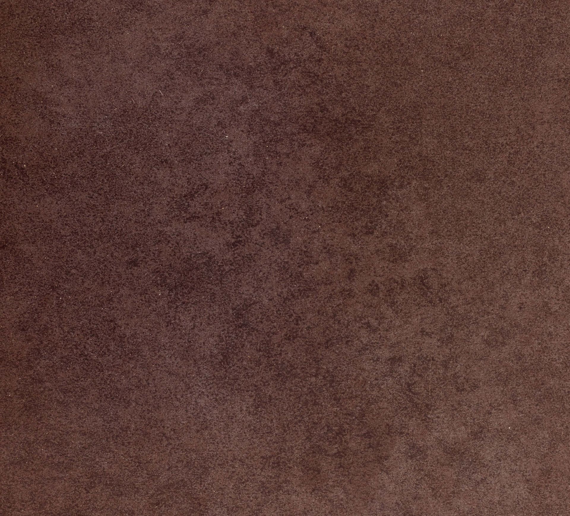 Dark brown, textured background, resembling suede or aged leather.