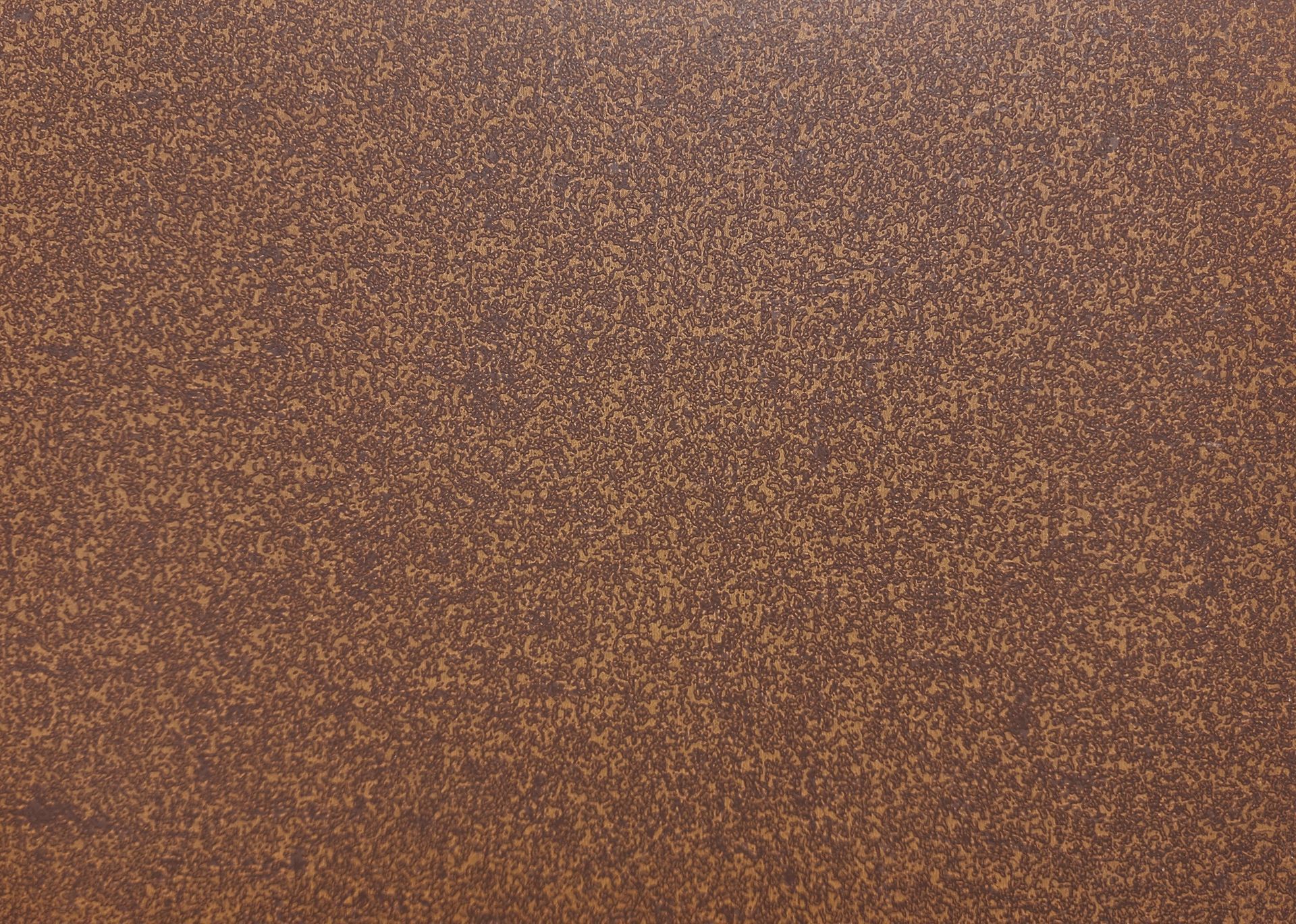 Dark brown speckled surface.