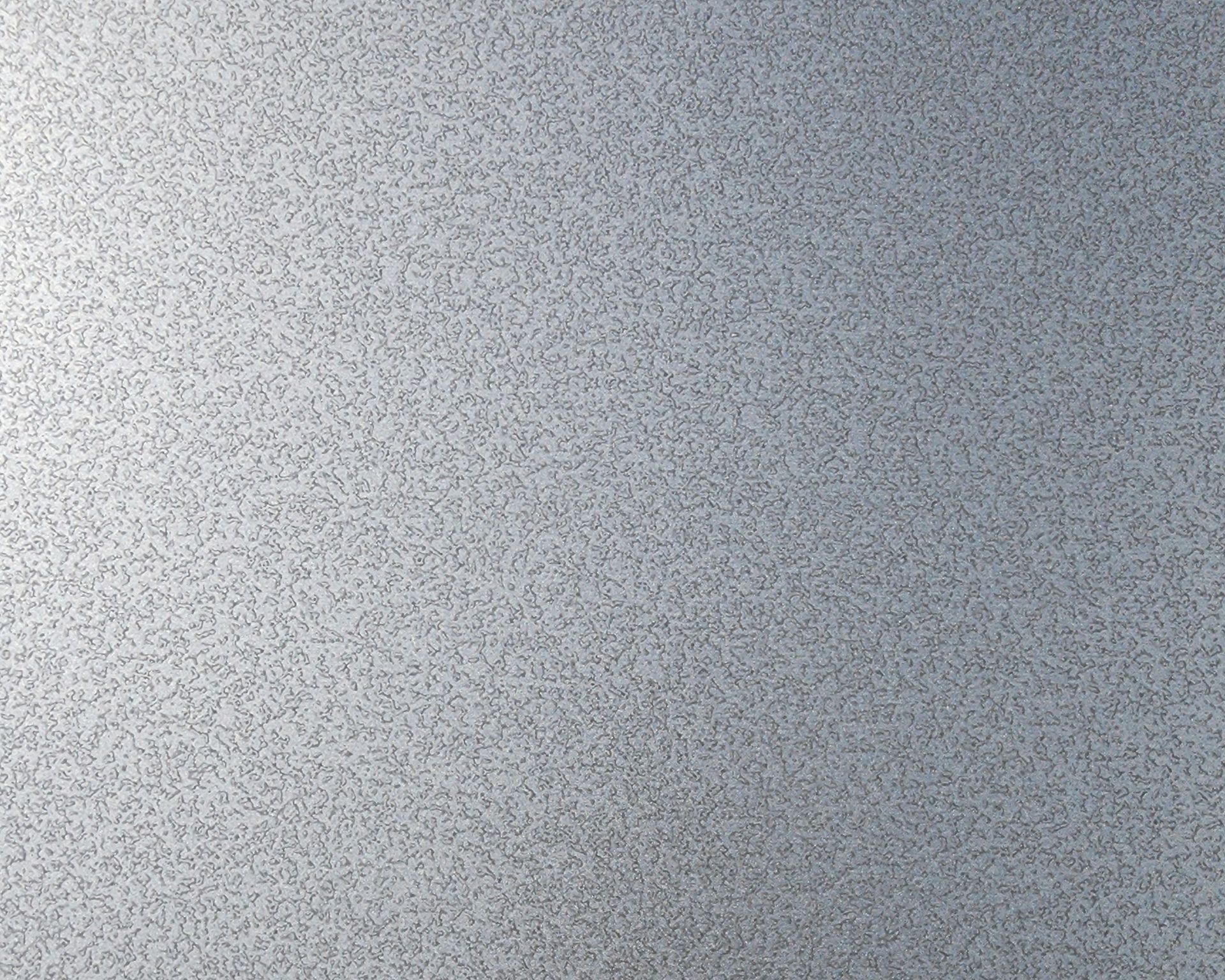 A light grey ceiling tile with many small, dark speckles.