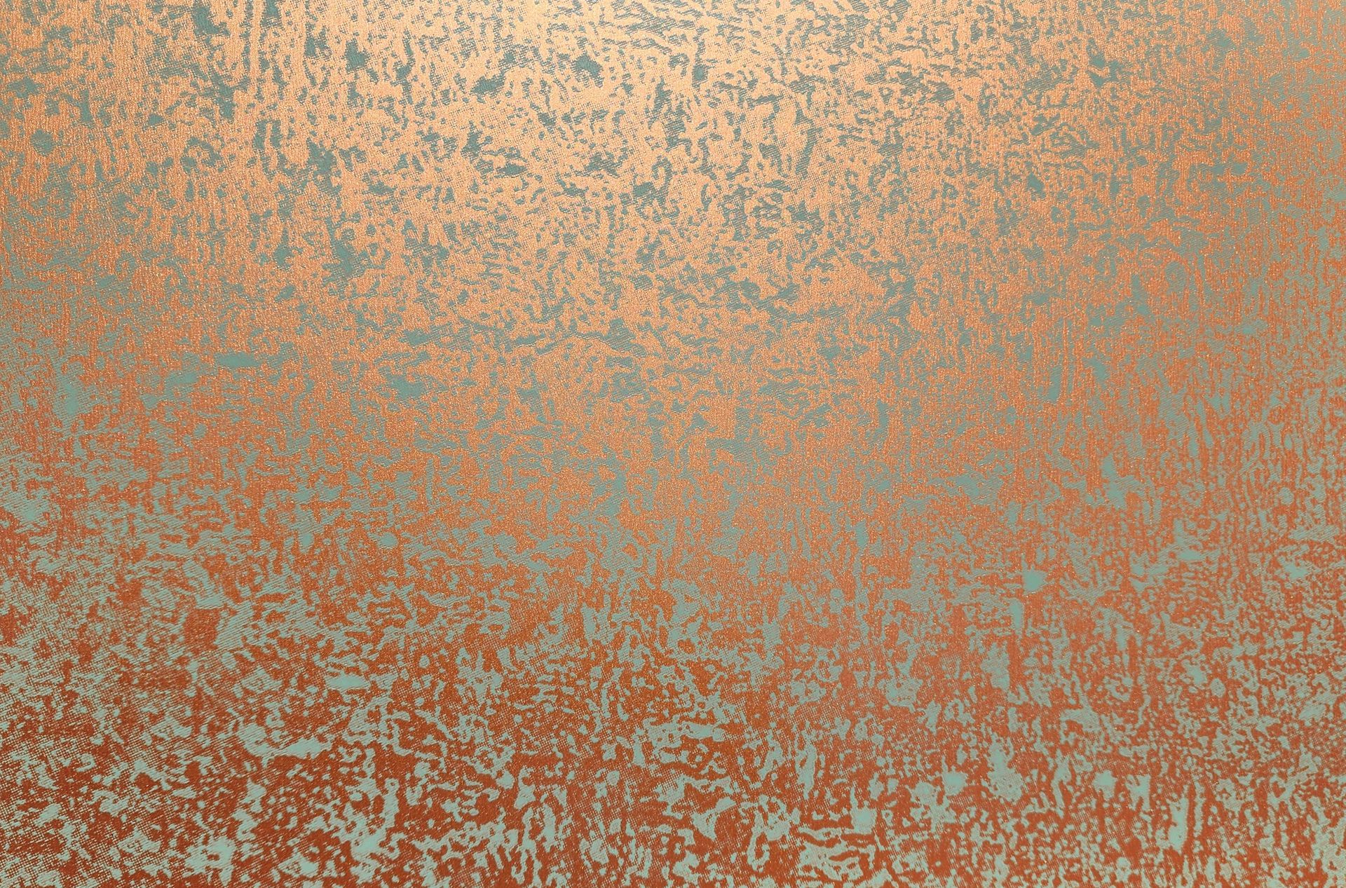 Copper-colored, textured surface with a speckled pattern.
