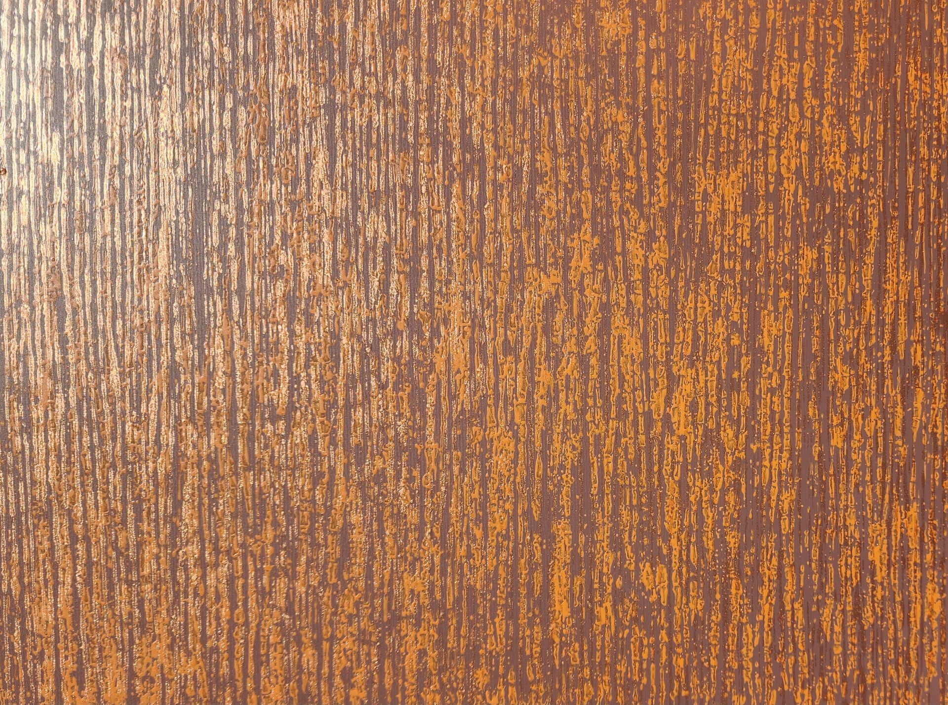 Brown and orange textured surface, possibly wood grain. Vertical lines with a rough, mottled appearance.