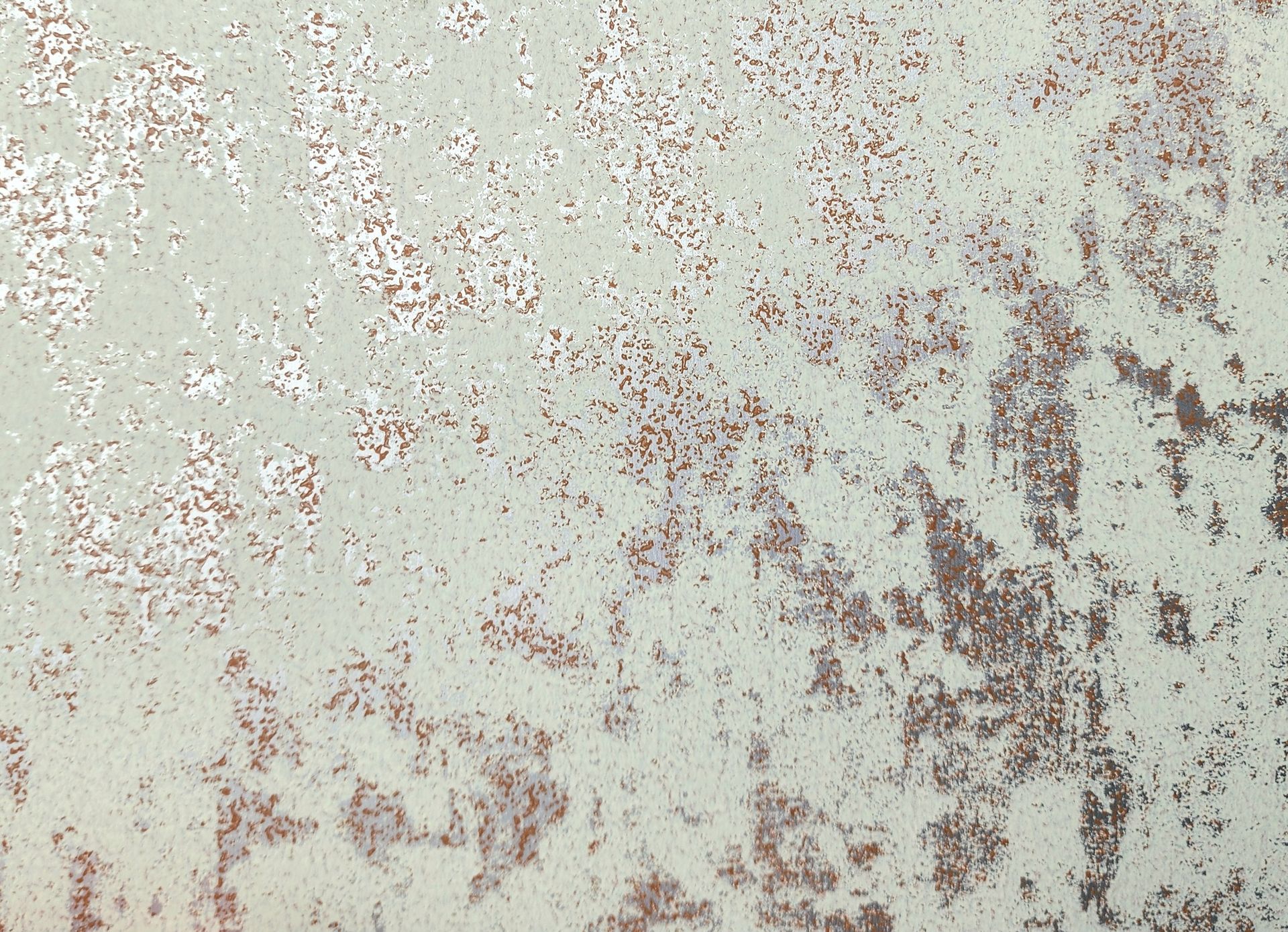 Textured surface with pale green paint, metallic silver and brown rust effect.