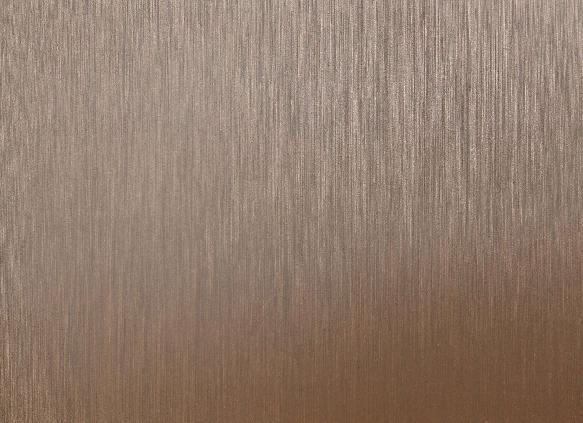 Brushed metal texture in a warm, light brown with vertical grain.