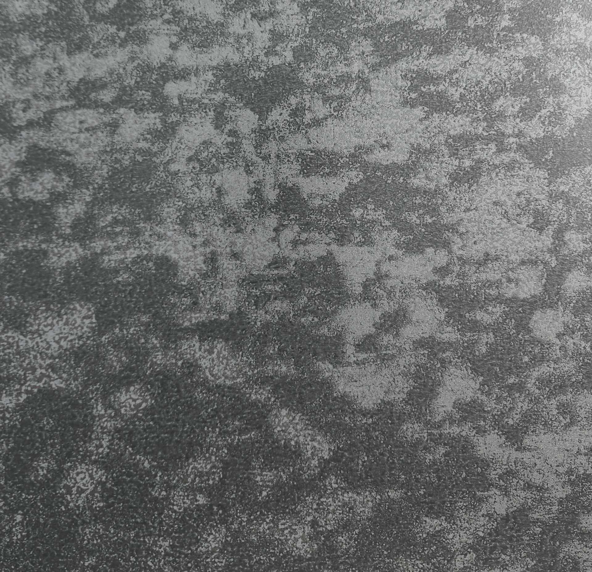 Dark gray, textured background with irregular mottled pattern.