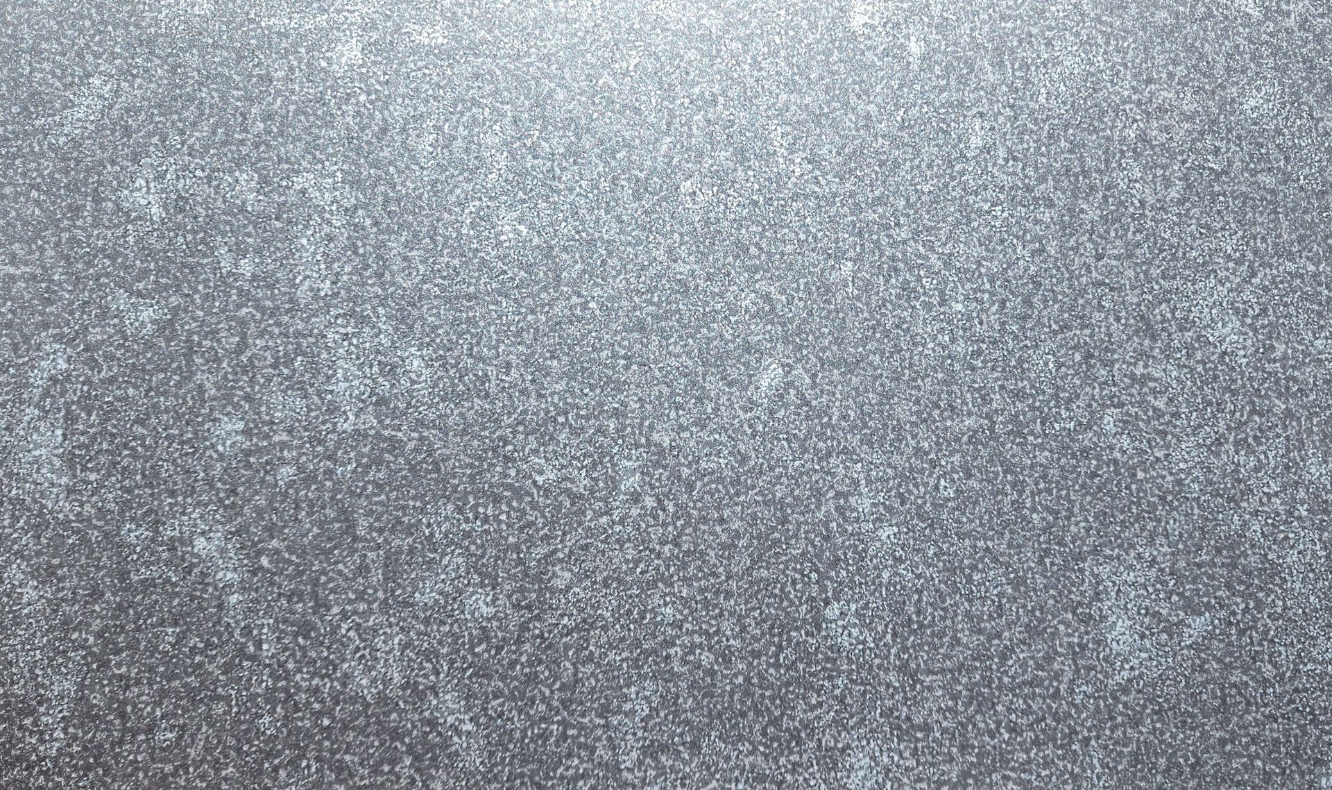 Silver, glittery surface with subtle texture and slight highlight at top.
