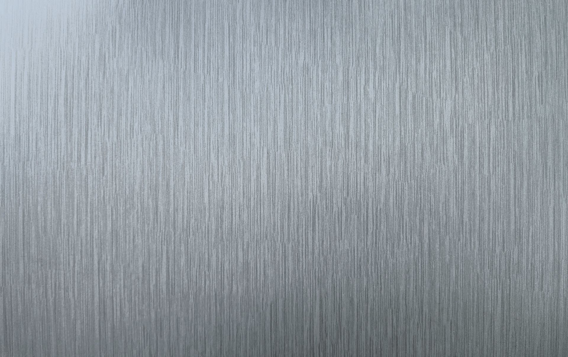 Brushed silver metal texture with vertical grain.