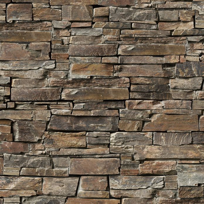 Stone wall with varied shades of brown and gray bricks arranged in a stacked pattern.