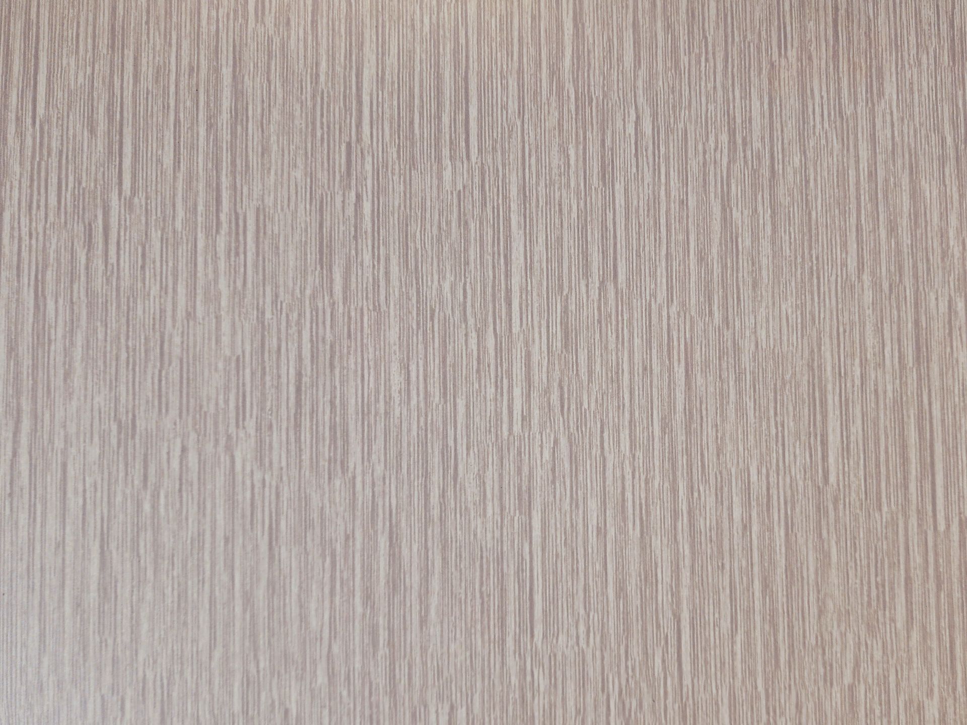 Textured, beige surface with vertical, linear grain.
