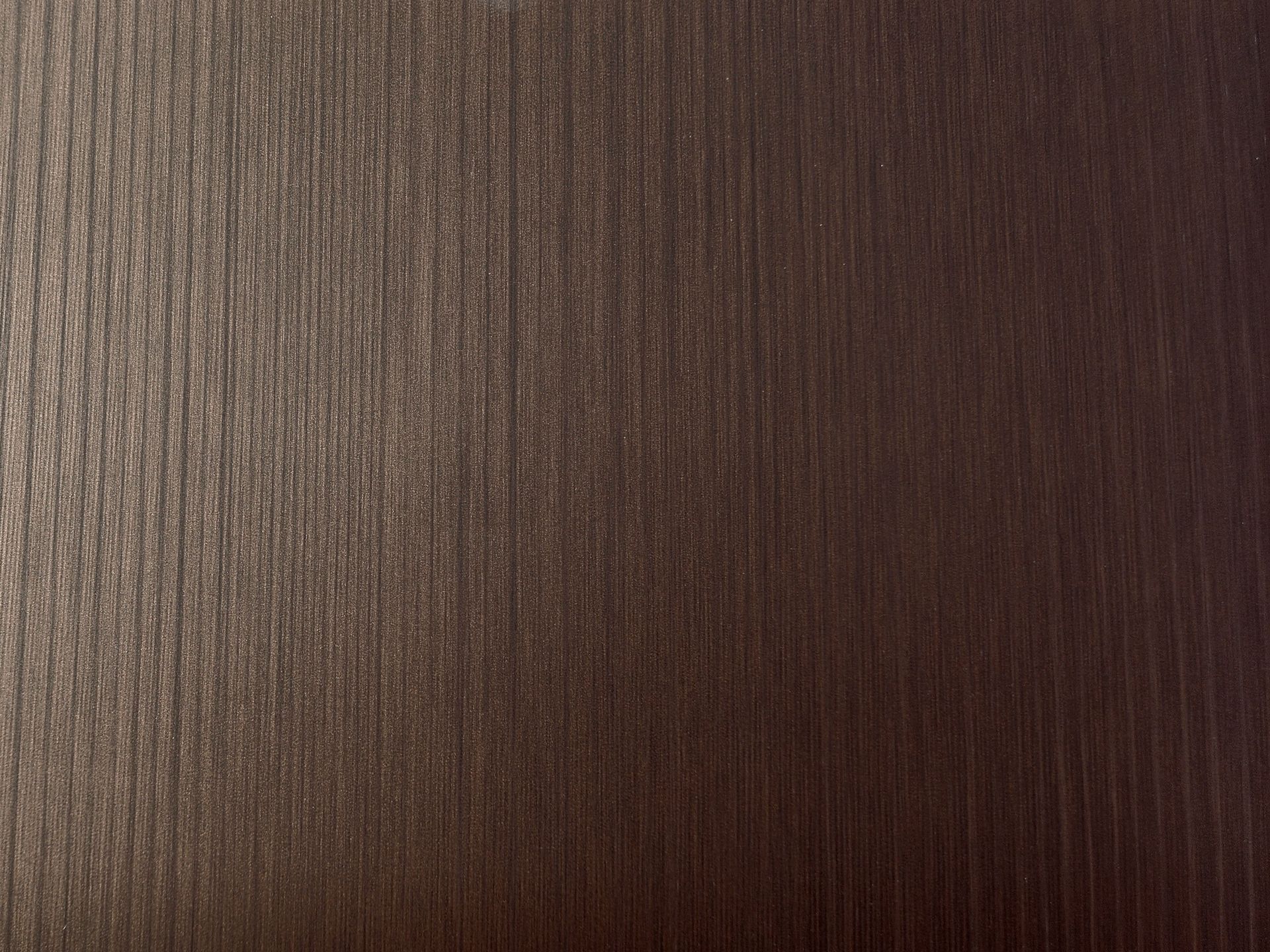 Dark brown wood grain texture.