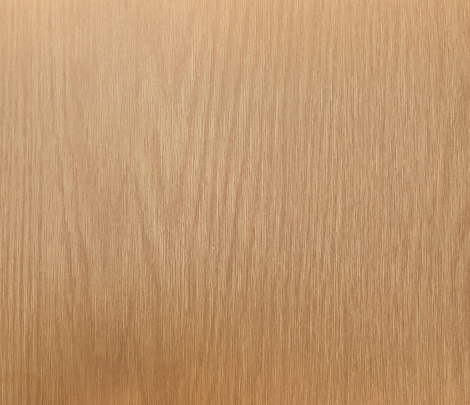 Close-up of light brown wood grain with vertical streaks.
