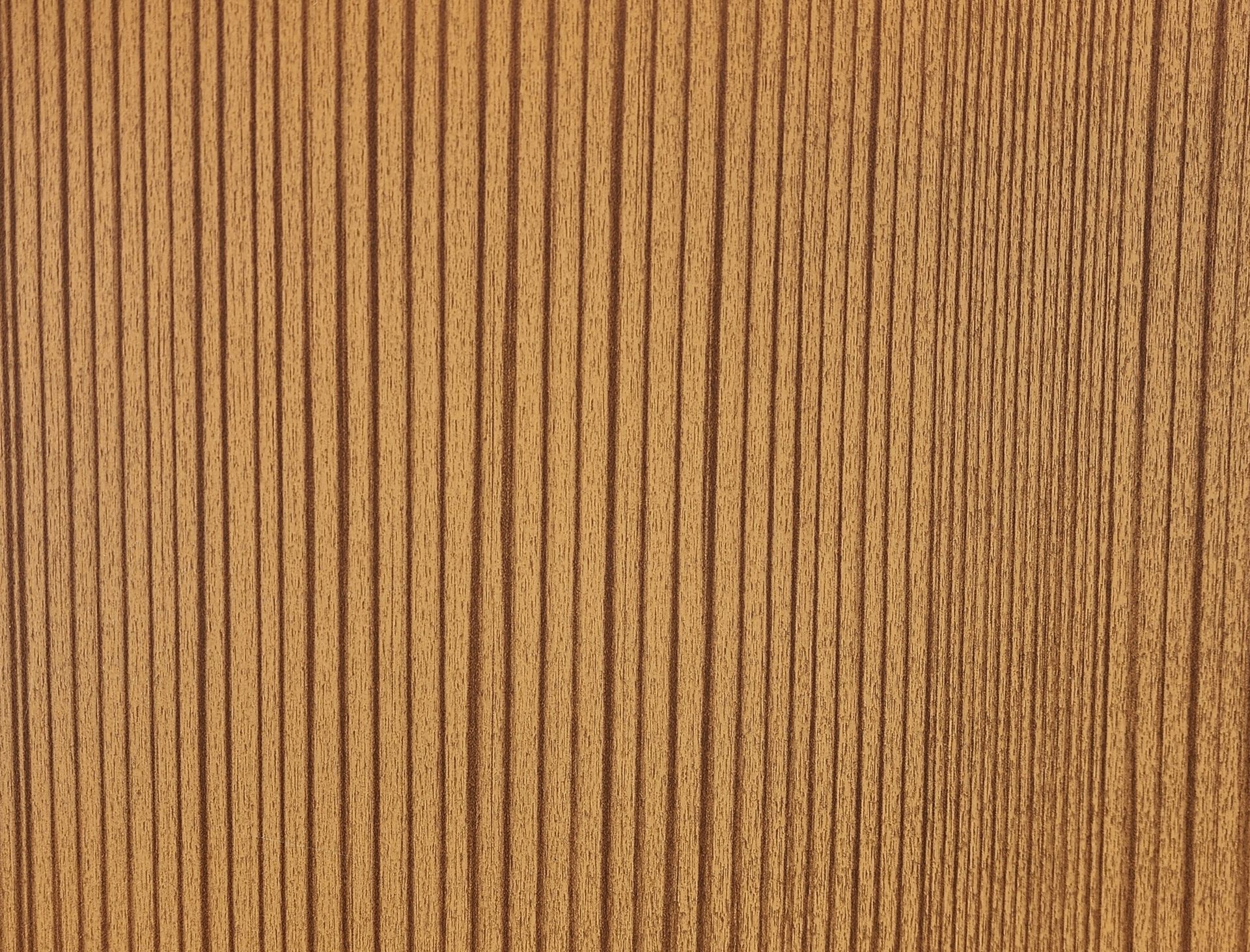 Close-up of wood grain texture with vertical lines in shades of brown and tan.