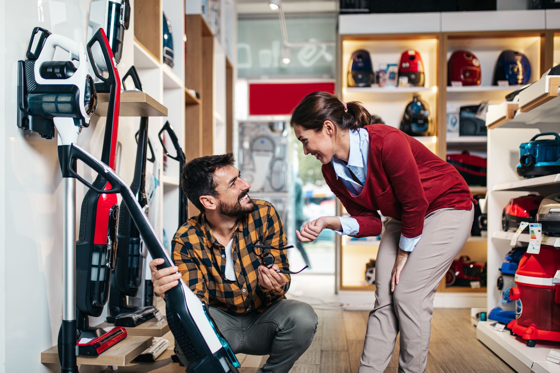Man Picking a Vacuum to Buy