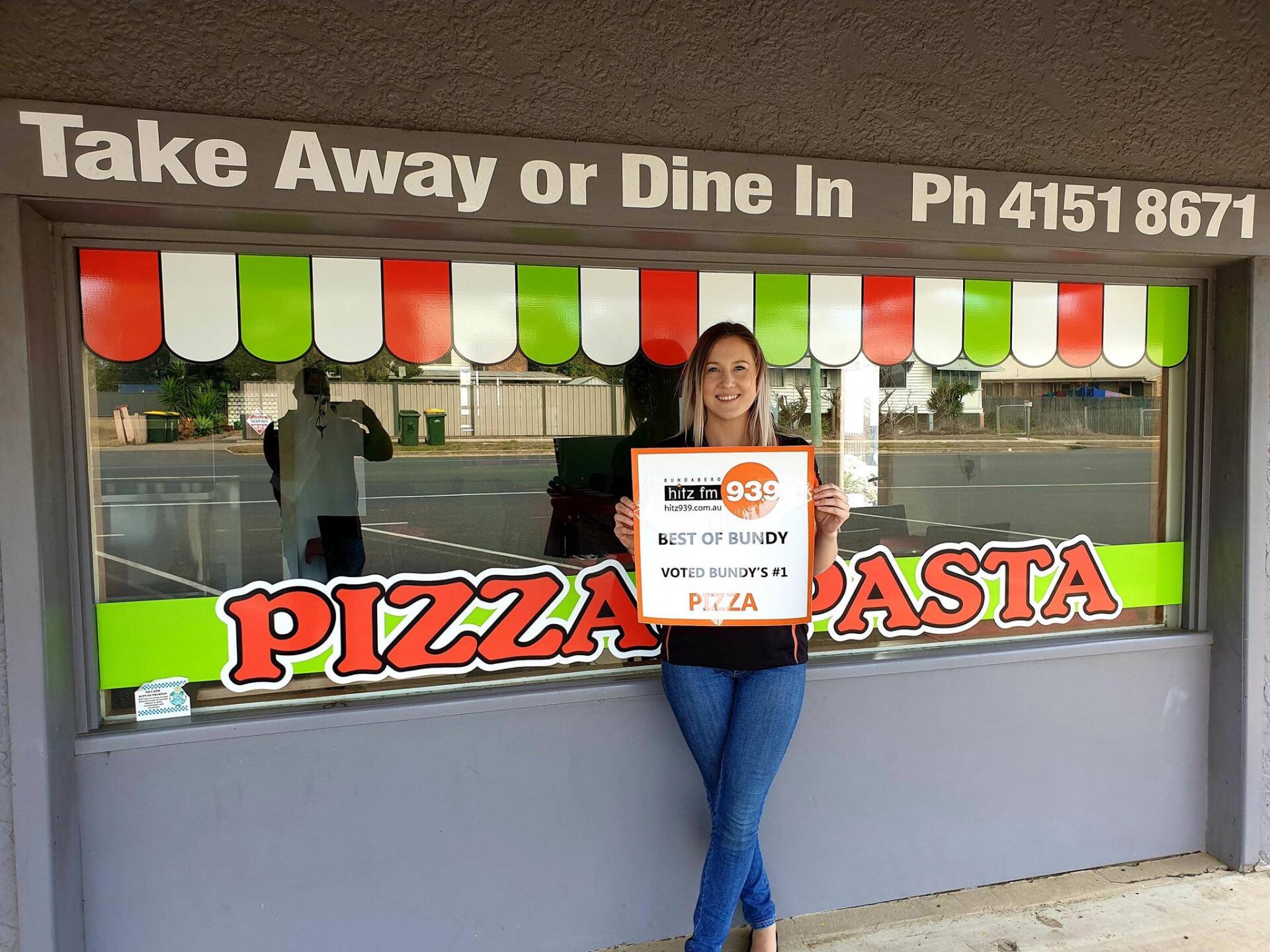 Worker Outside Restaurant — Bella M Pizzas in Bundaberg North, QLD