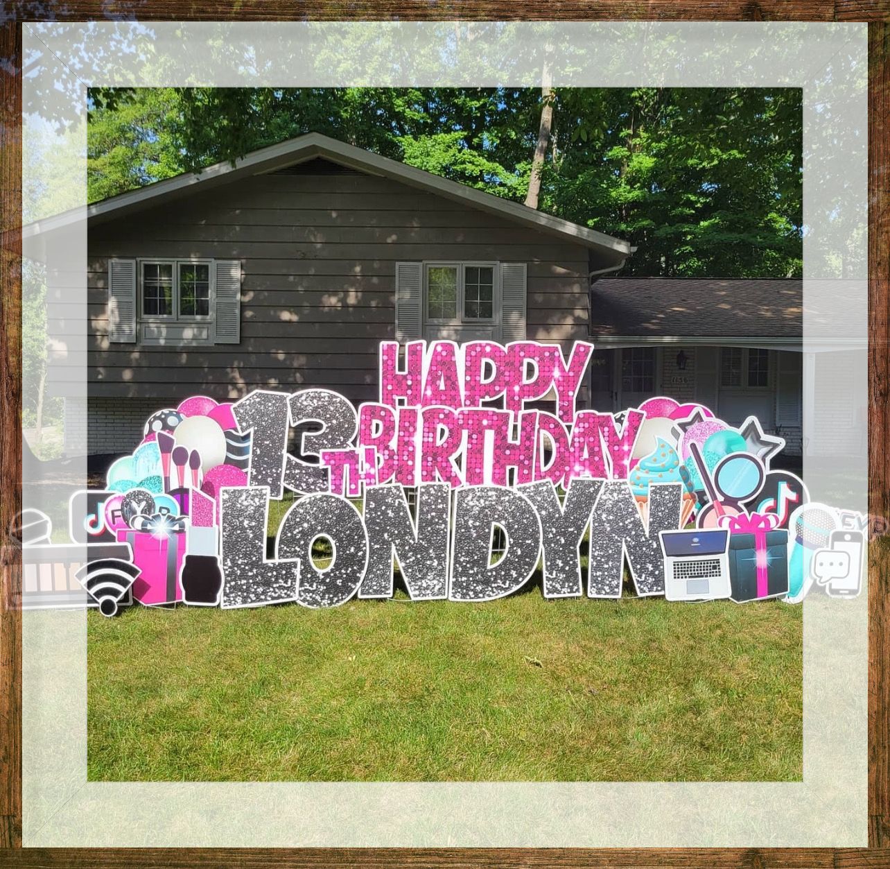 A framed picture of a happy birthday sign for a girl