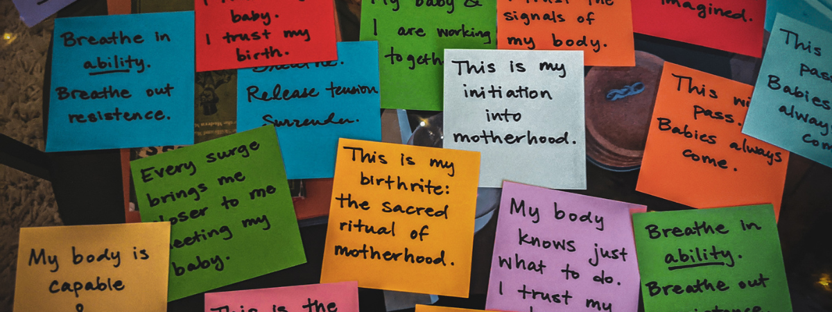 Positive birth affirmations written on colourful notes for labour and birth preparation