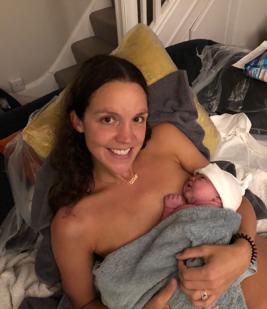Mother and baby skin-to-skin in early moments after birth, featured in the podcast