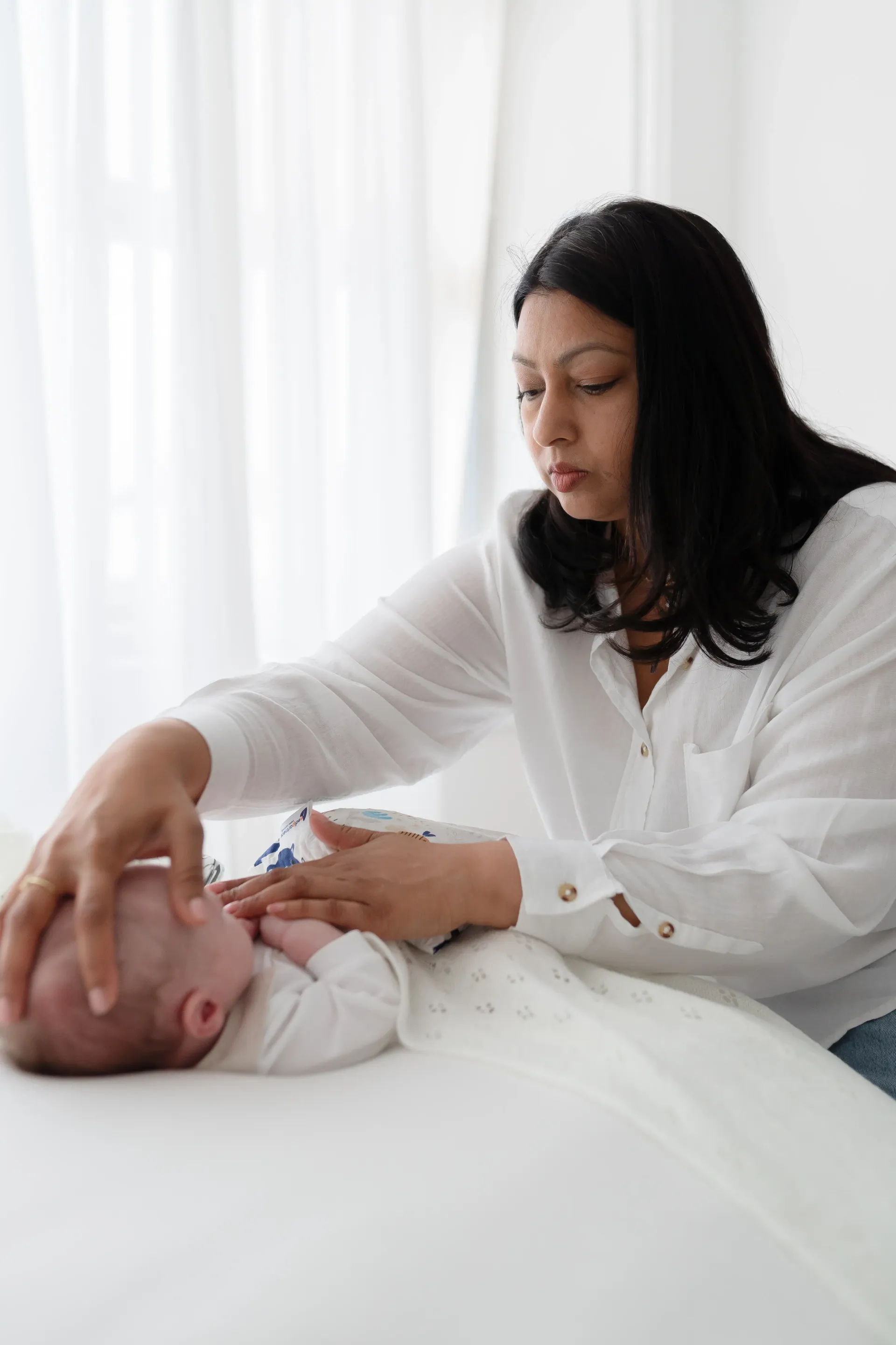 Lifestyle newborn photographer capturing family moments in Wimbledon