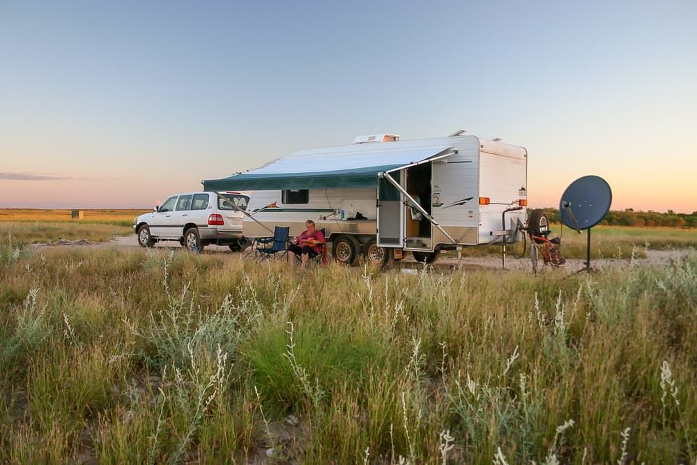 A RV is Parked in the Middle of a Grassy Field — Waring's Auto Electrical in South Geelong, VIC