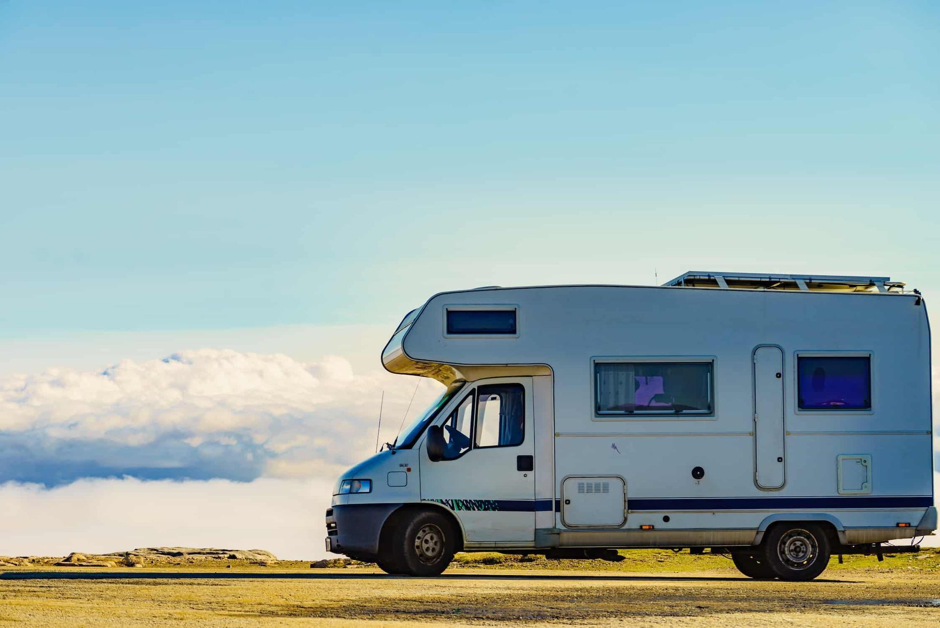 A White RV is Parked on the Side of the Road — Waring's Auto Electrical in South Geelong, VIC
