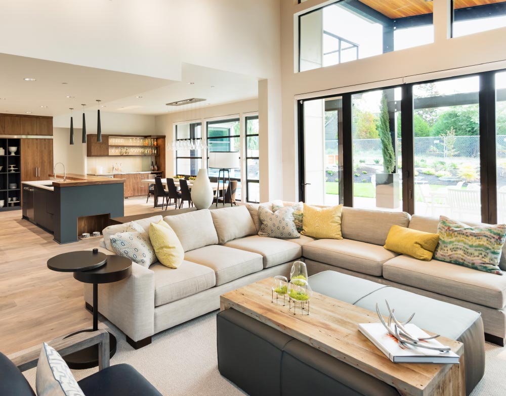 a living room with a large sectional couch and a coffee table .