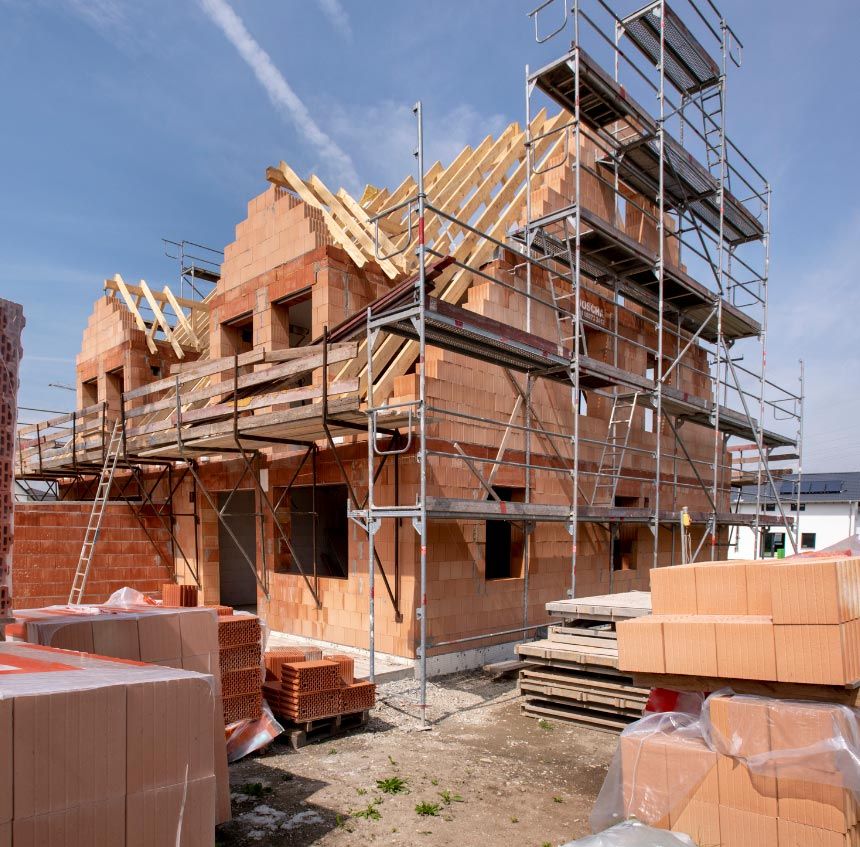 a house is being built with bricks and scaffolding