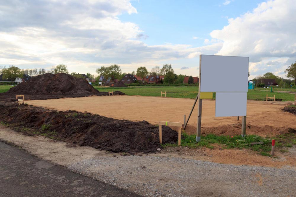 a construction site with a sign in the middle of it