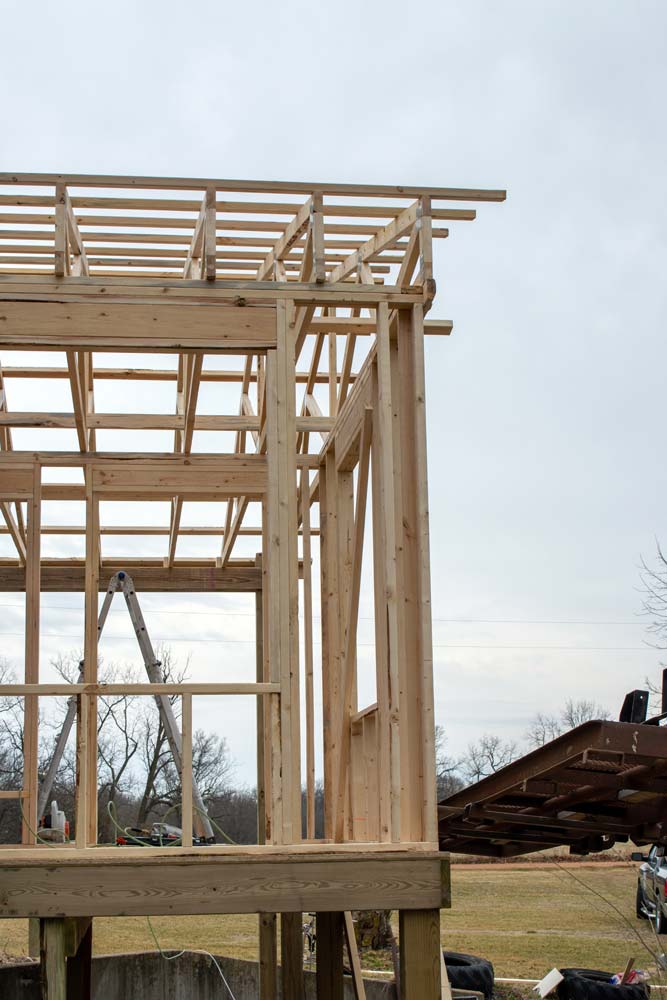 a wooden structure is being built in a field