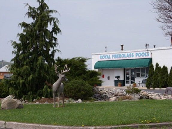 Deer sculpture on a lawn in front of store