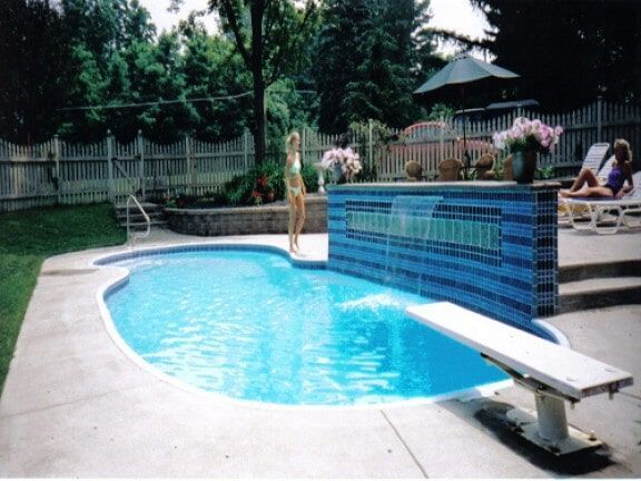 Backyard pool with blue tiled wall